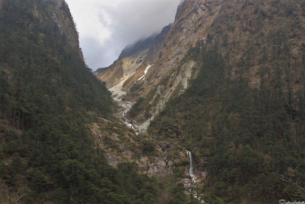 Tall wasterfall between two snow mountains at sikkim