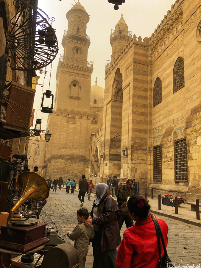 Most beautiful street of cairo with minarets and beige sandstone with sepia colour sky