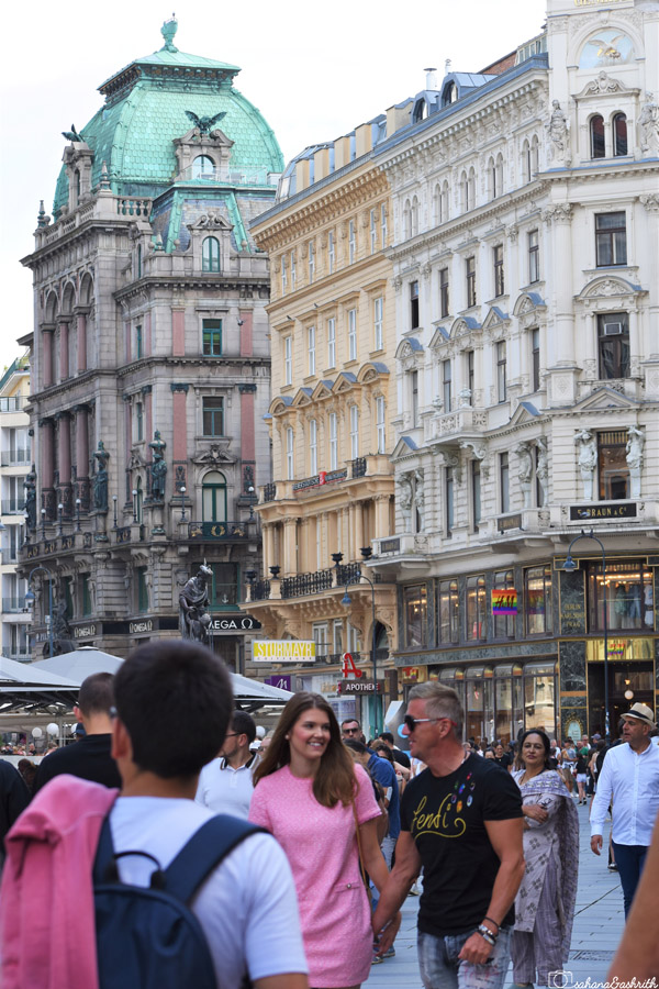 Lot of tourists shopping at Austria's plaza surrounded by historical building