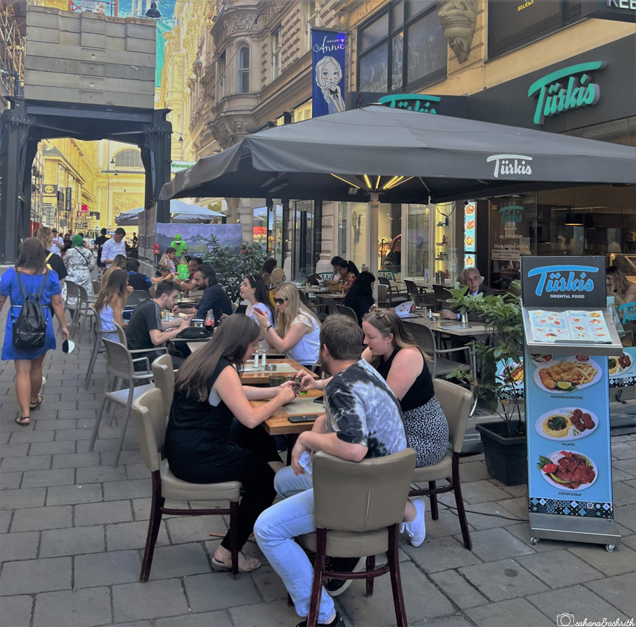street cafe buzzing with people in Austria