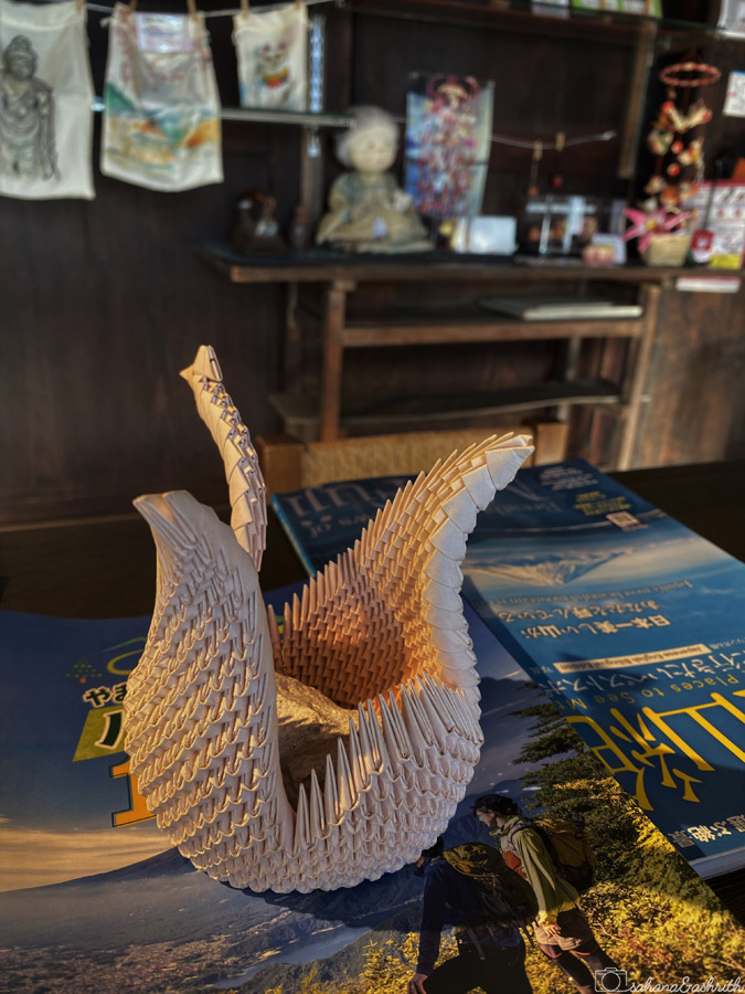 swan kind of figurine made by folding paper origami in Japan
