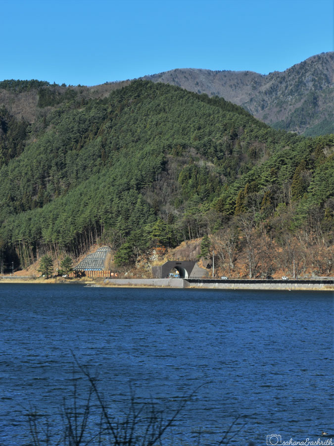 blue colour lake saiko surrounded by mountains at Fuji five lake area