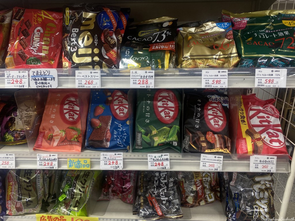 weird flavours of kitkat stocked in a a shelf at convenience store in japan