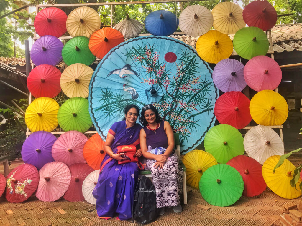 indian woman in saree sitting with her daughter
