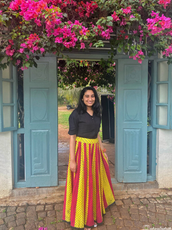 indian girl wearing flared cotton skirt from Gujarat pairing it with black casual stylish shirt