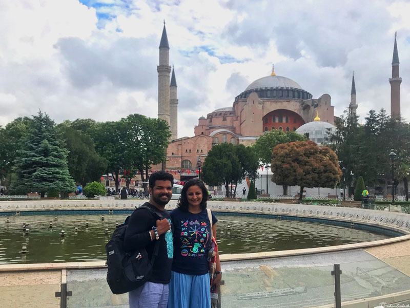 Ashrith and Sahana standing in front of Hagia Sophia in istanbul on a cloudy day
