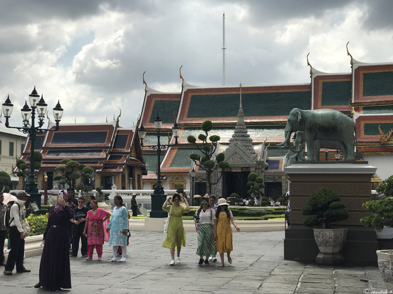 a group of tourists at grand palace of Bangkok
