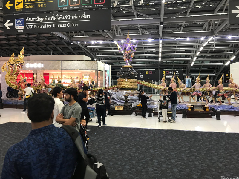 tourists waiting in line inside survarna bhoomi airport to get their Thailand Visa