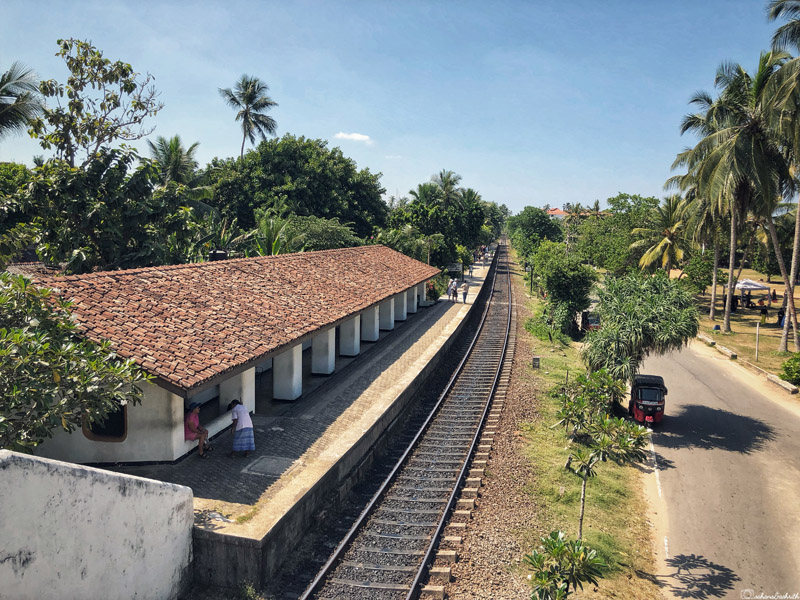 Sri Lanka travel guide showcasing Bentota railway station bordered by temple trees