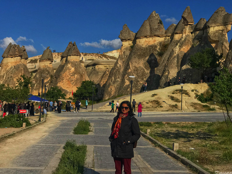 vacaywork author sahana at Pasabag valley in front of conical formations topped with dark stones