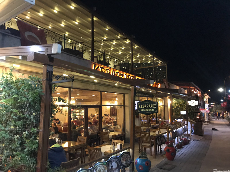 kebapzade restaurant by road side in goreme decorated with lights