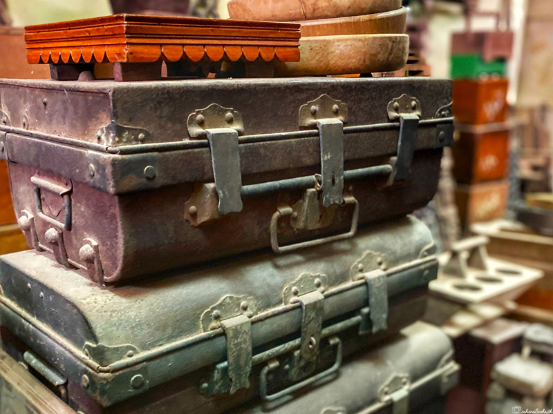 Stacked antique suitcases at the Karaikudi antique market.