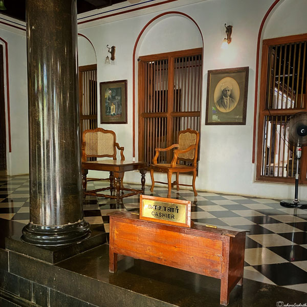 entrance of a chettinadu mansion with traditional cashier desk
