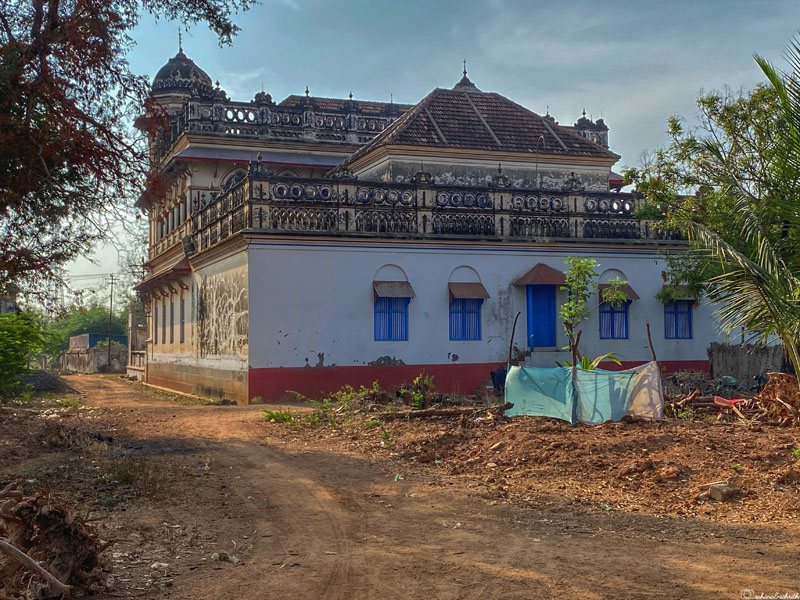 Abandoned Chettinad mansion in a village, enveloped by banana plantations, accessible via a mud road