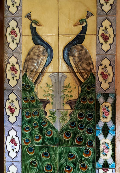 Belgian tiles showing very detailed peacock design