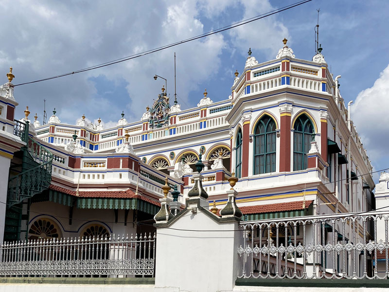 detailed luxury facade of Chettinad Maharaja palace seen from road