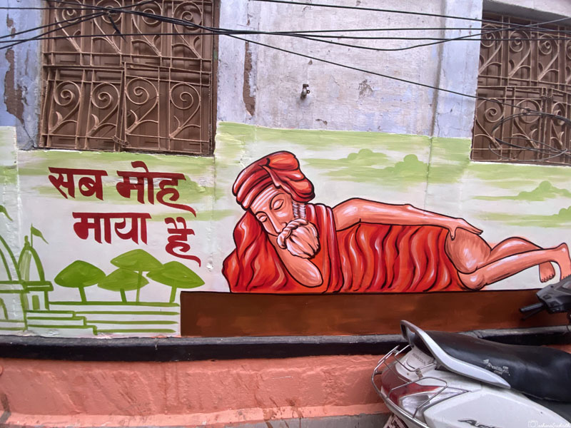 wall graffiti of a saint sleeping peacefully at banaras 