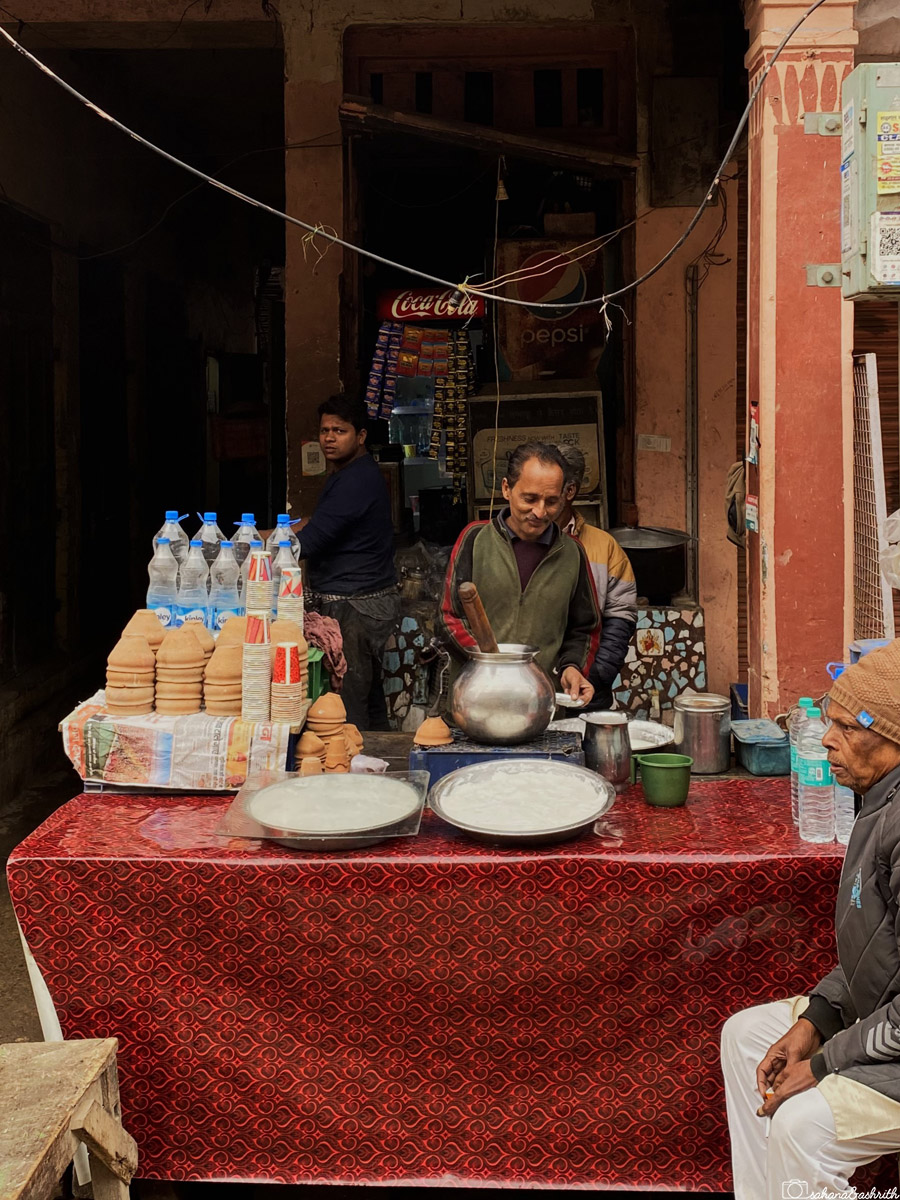 A vendor preparing traditional lassi at a street stall in Varanasi.
