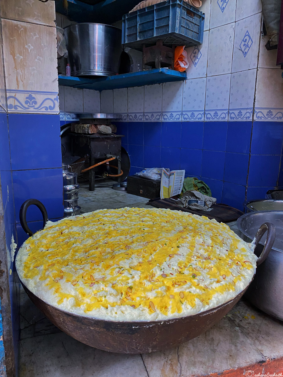 A large bowl of freshly prepared Malaiyo in a big kadai ay Varanasi kitchen.