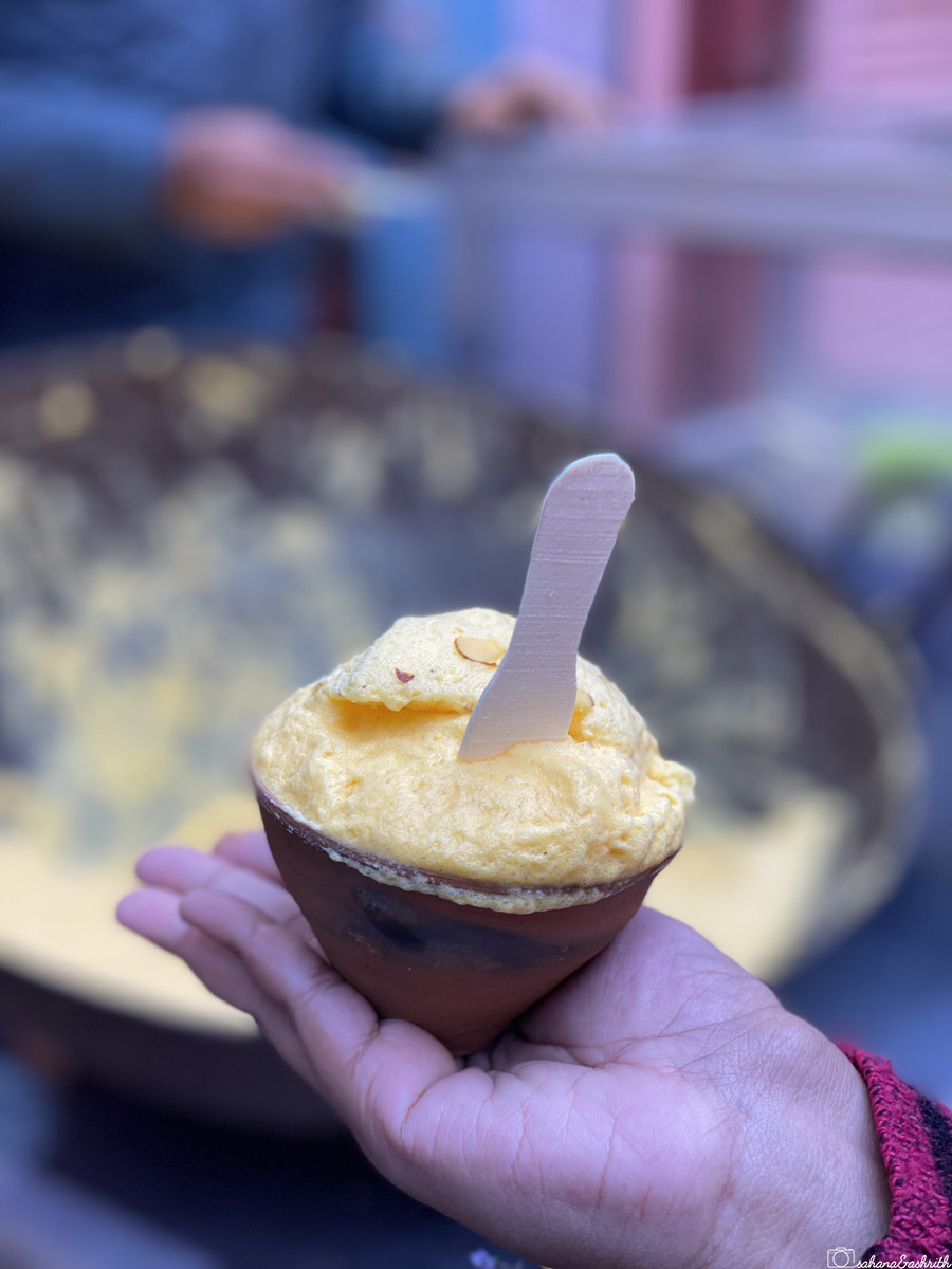 A serving of Malaiyo, a traditional Varanasi dessert in earthen pot