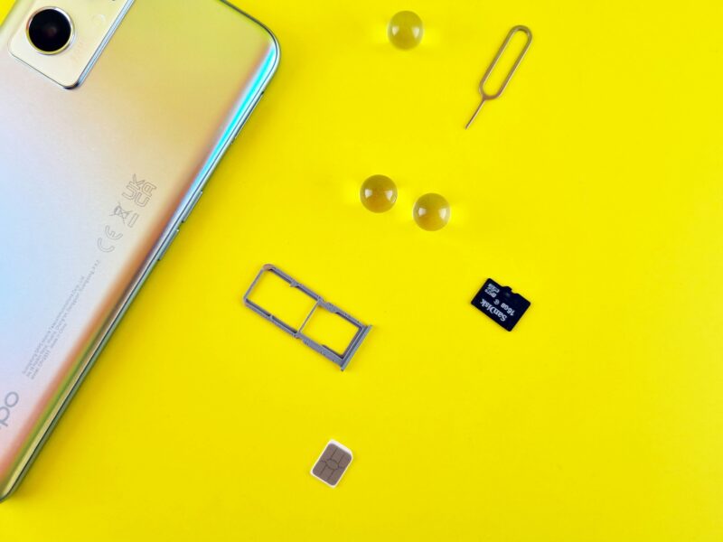 A smartphone, SIM tray, ejector pin, and memory card displayed on a yellow background.
Image 2: Pricing chart for data-only SIM cards in Japan with different durations, data allowances, and total costs.