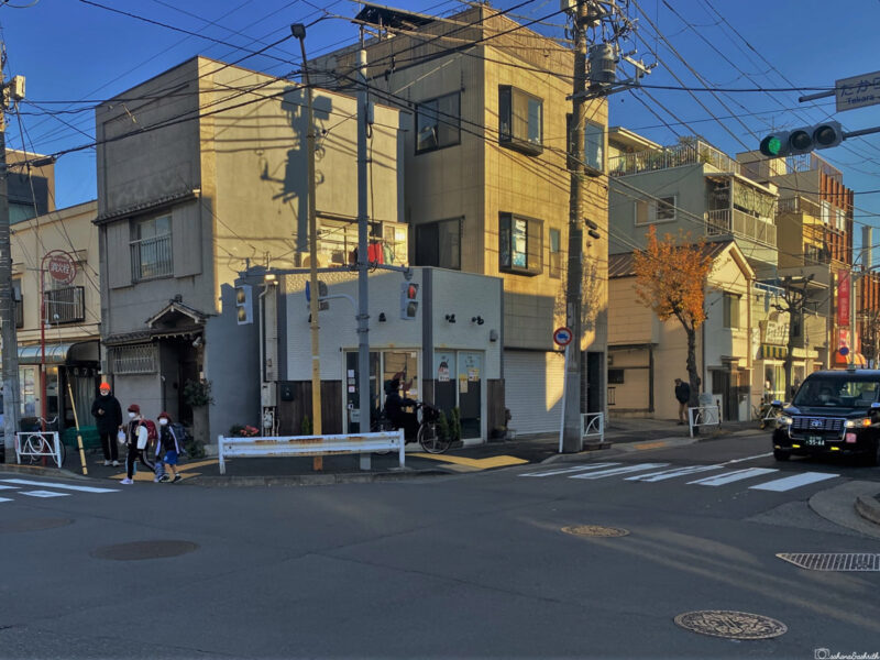 A quiet street in a residential neighborhood of Sumida Ward, Tokyo, under afternoon sunlight