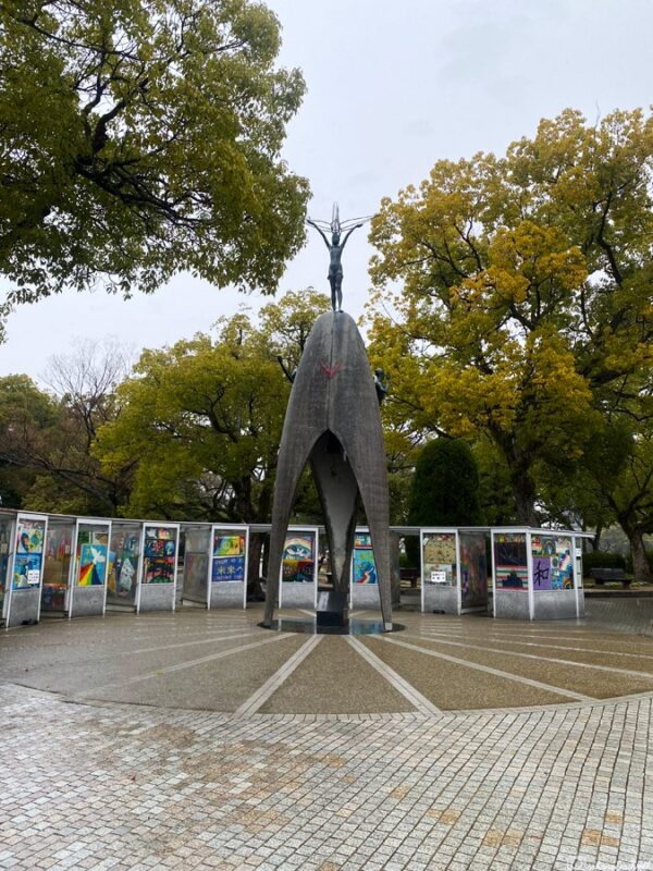 Children's Peace Monument in Hiroshima, featuring origami crane displays by children and the statue with Sadako Sasaki symbolising peace