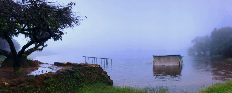 place beside a lake in chikmagalur partially covered in hog and hut