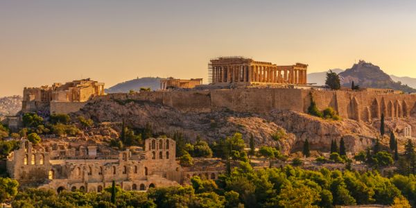 sight of acropolis on hills with athens town at foothill during sunset