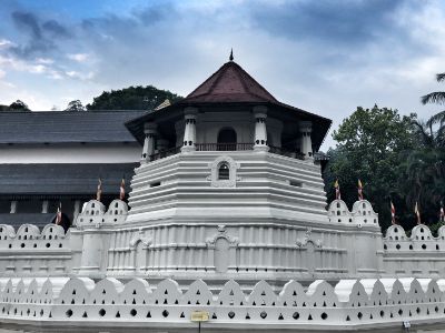 kandy temple with white walls and octagonal sloped tiled roof