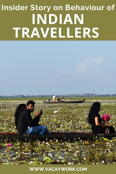 indian tourists on slim boat going between lotus plants at malarikkal lake in kerala