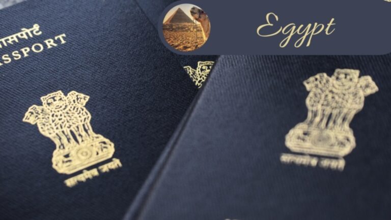 two indian passports next to each other with egypt symbol pyramids kept on it