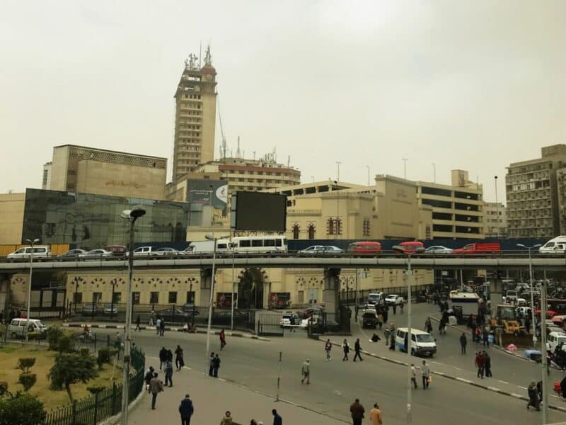 Traffic and people outside Ramses Railway Station in Cairo, Egypt.