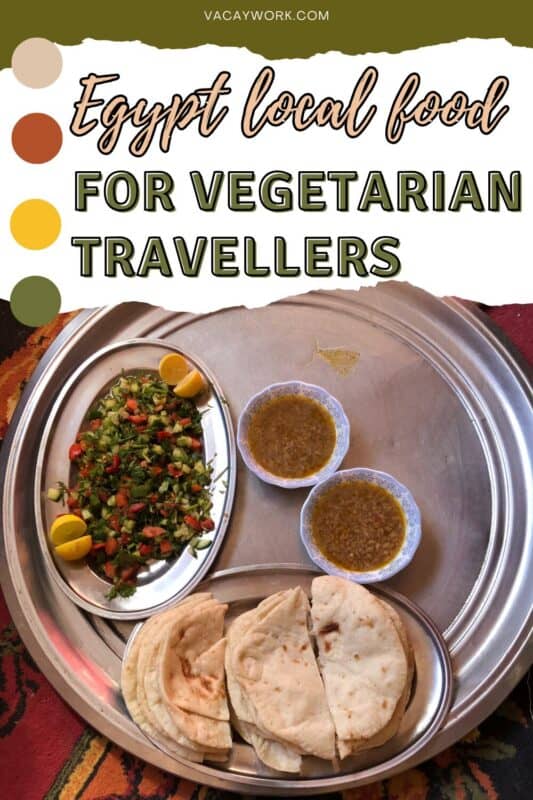 Traditional Egyptian vegetarian meal with salad, bread and lentil bowls served on a silver tray with text overlay that says Egypt local food for vegetarian travellers
