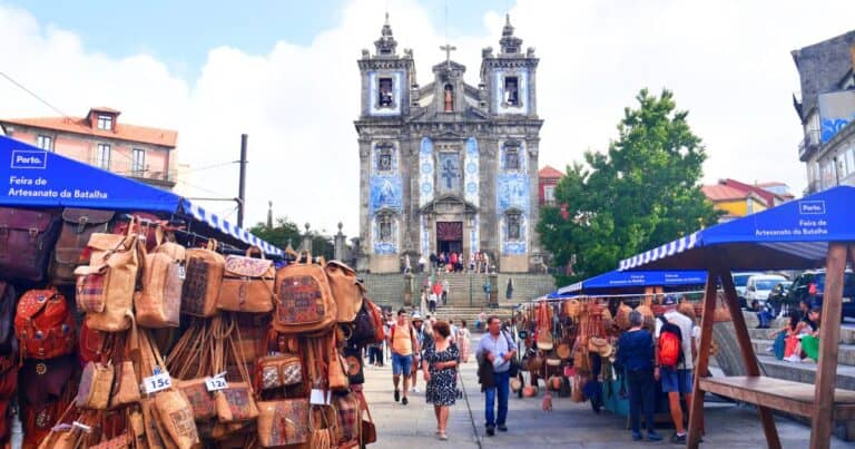 Street market in Porto Portugal selling cork bags and handmade souvenirs
