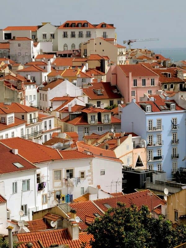 Close view of colourful rooftops and pastel buildings in Lisbon neighbourhoods