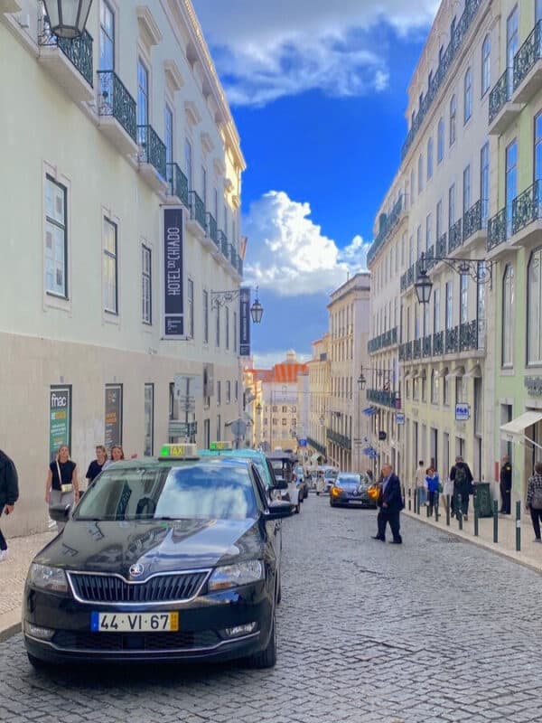 Rua Nova da Almada in Lisbon with historic façades, cobbled streets and views towards Baixa