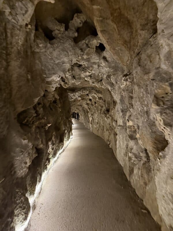 Quinta da Regaleira underground tunnel with rough stone walls
