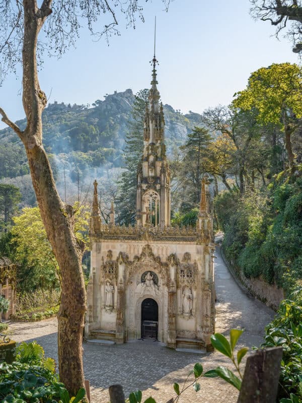 Quinta da Regaleira chapel with a tall Gothic tower and gardens