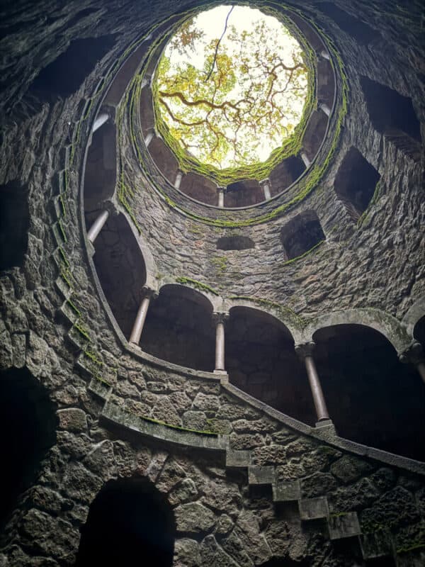 Quinta da Regaleira initiation well viewed from below with its stone staircase