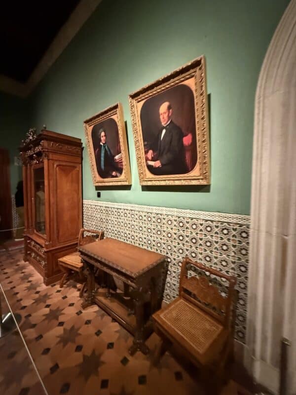Quinta da Regaleira interior with portraits, carved furniture and patterned tiles