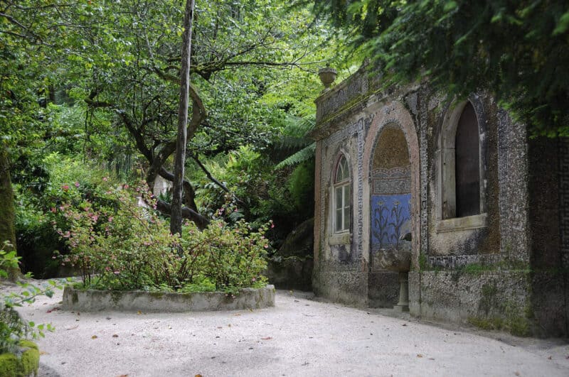 Quinta da Regaleira garden path beside an old tiled building