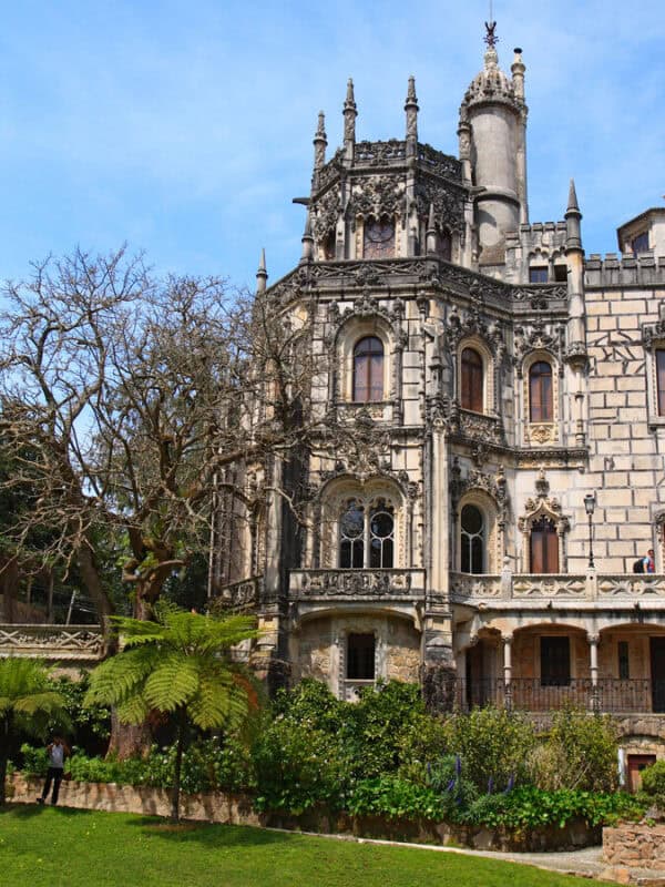 Quinta da Regaleira palace framed by trees and green gardens