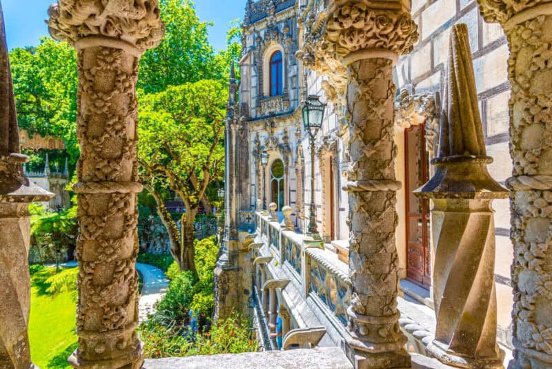 Quinta da Regaleira palace balcony framed by ornate stone columns